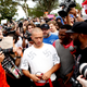 A man wearing a shirt with swastikas is forced away from the scene by the crowd moments after being punched by an unidentified member of the crowd near the site of a planned speech by white nationalist Richard Spencer at the University of Florida campus on Oct. 19, 2017, in Gainesville, Fla. (Brian Blanco/Getty Images)